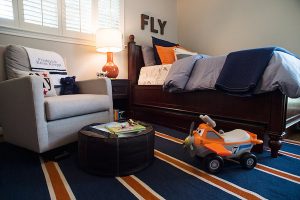 A navy and orange little boys room.