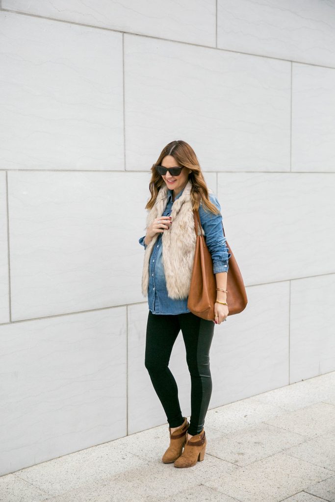 how to style a denim shirt and fur vest.