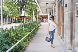 how to style a off the shoulder top with denim.